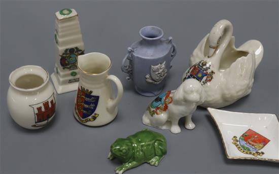 A collection of crested china and two leather suitcases